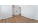 Bedroom featuring wood-look floors, closet, and a doorway leading to another room at 3915 Delling Ct, Las Vegas, NV 89104