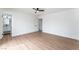 Bright bedroom with light wood flooring, ceiling fan and attached bathroom at 3915 Delling Ct, Las Vegas, NV 89104