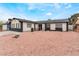 Welcoming single-story house boasting unique rock landscaping and inviting curb appeal at 3915 Delling Ct, Las Vegas, NV 89104
