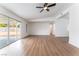 Expansive living area featuring light-colored floors, sliding glass doors to outdoor views, and ample space at 3915 Delling Ct, Las Vegas, NV 89104
