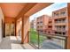 Outdoor balcony view showcasing colorful buildings and community surroundings with a metal railing at 43 E Agate Ave # 305, Las Vegas, NV 89123