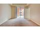 Bedroom featuring an exterior sliding door, neutral paint, and carpeted flooring at 43 E Agate Ave # 305, Las Vegas, NV 89123