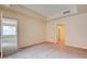 Carpeted bedroom featuring neutral paint, an attached closet, and an opening to the dining area at 43 E Agate Ave # 305, Las Vegas, NV 89123