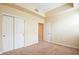 Carpeted bedroom featuring a large window, a closet, baseboards, and neutral paint at 43 E Agate Ave # 305, Las Vegas, NV 89123