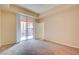 Bedroom featuring an exterior sliding door, neutral paint, and carpeted flooring at 43 E Agate Ave # 305, Las Vegas, NV 89123