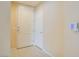 A clean and well-maintained entryway featuring neutral walls, tiled flooring, and a white entry door at 43 E Agate Ave # 305, Las Vegas, NV 89123