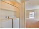 Convenient laundry area featuring a stacked washer and dryer near the living area, maximizing space and efficiency at 43 E Agate Ave # 305, Las Vegas, NV 89123