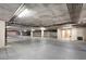Well-lit, spacious parking garage showing ample parking spots and fire safety systems at 43 E Agate Ave # 305, Las Vegas, NV 89123