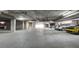 Parking garage featuring painted parking spots with multiple vehicles parked in designated areas at 43 E Agate Ave # 305, Las Vegas, NV 89123
