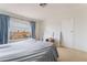 Bedroom featuring a window, an open door and carpet floor at 4712 Belshire Dr, Las Vegas, NV 89147