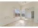 Bright bedroom with tile floors and large windows providing natural light at 4712 Belshire Dr, Las Vegas, NV 89147