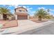 Charming home featuring a two-car garage, a long driveway, and mature palm trees at 4712 Belshire Dr, Las Vegas, NV 89147