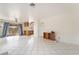 Spacious living room showcasing tile flooring and sliding glass doors to the backyard at 4712 Belshire Dr, Las Vegas, NV 89147