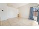 Bright living room featuring high ceilings, neutral paint, and tiled floors at 4712 Belshire Dr, Las Vegas, NV 89147