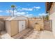 Backyard featuring a shed, a block wall, landscaping, and a gate at 4712 Belshire Dr, Las Vegas, NV 89147
