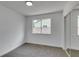 Cozy bedroom features plush carpet, closet, and a window providing natural light at 4855 San Sebastian Ave, Las Vegas, NV 89121