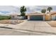 Charming single-story home with a well-maintained yard and a two-car garage, providing curb appeal and convenience at 4855 San Sebastian Ave, Las Vegas, NV 89121