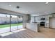 Modern kitchen with white cabinets, bar area and backyard views at 4855 San Sebastian Ave, Las Vegas, NV 89121
