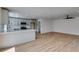 Kitchen with white cabinets, countertops and light wood floors at 4855 San Sebastian Ave, Las Vegas, NV 89121