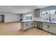 Bright, open kitchen boasts white cabinets, stainless appliances, and seamless flow into the adjacent living area at 4855 San Sebastian Ave, Las Vegas, NV 89121
