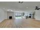 Open-concept living room featuring recessed lighting, wood flooring, and a kitchen view at 4855 San Sebastian Ave, Las Vegas, NV 89121