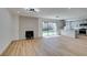 Open living room and kitchen area with fireplace and backyard access at 4855 San Sebastian Ave, Las Vegas, NV 89121