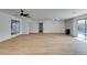 Large living room with light wood floors, ceiling fan and fireplace at 4855 San Sebastian Ave, Las Vegas, NV 89121