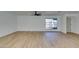Spacious living room with light wood floors, ceiling fan and lots of natural light at 4855 San Sebastian Ave, Las Vegas, NV 89121