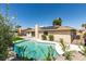 Backyard with a refreshing pool, solar panels, and well-maintained landscaping, ideal for relaxation and entertainment at 4855 San Sebastian Ave, Las Vegas, NV 89121