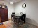 The dining room includes a wood table, chairs, and wood-look floors at 5055 W Hacienda Ave # 2175, Las Vegas, NV 89118