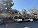 Exterior view of the condos with covered parking and a blue sky backdrop at 5055 W Hacienda Ave # 2175, Las Vegas, NV 89118