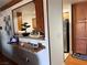 View of the kitchen pass-through and dining area at 5055 W Hacienda Ave # 2175, Las Vegas, NV 89118