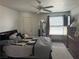 Bright main bedroom with a ceiling fan, a window providing natural light, and classic bedroom furniture at 5055 W Hacienda Ave # 2175, Las Vegas, NV 89118
