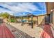Home's backyard features patio covers, gazebo and low-maintenance gravel, perfect for relaxation at 5093 Sun Valley Dr, Las Vegas, NV 89122