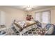 Bedroom featuring a bed, patterned rug, and natural light from a window at 5093 Sun Valley Dr, Las Vegas, NV 89122