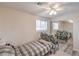 Bright bedroom with a window, mirrored closet doors, and wood-look flooring at 5093 Sun Valley Dr, Las Vegas, NV 89122
