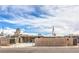 Street view showing a home's driveway with a wooden fence, offering both privacy and curb appeal at 5093 Sun Valley Dr, Las Vegas, NV 89122