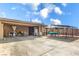 Home exterior showcasing a covered patio, outdoor furniture and ample space for recreational activities at 5093 Sun Valley Dr, Las Vegas, NV 89122