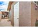 Exterior view of the house showing the outdoor shower, laundry, and storage shed at 5093 Sun Valley Dr, Las Vegas, NV 89122
