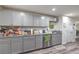 Kitchen with gray cabinetry, granite countertops, stainless steel appliances, and a door at 5093 Sun Valley Dr, Las Vegas, NV 89122