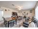 Open-concept living room with a ceiling fan, wood-look floors, and stone fireplace at 5093 Sun Valley Dr, Las Vegas, NV 89122