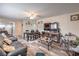Bright living room with wood-look floors and comfortable seating, open to the kitchen at 5093 Sun Valley Dr, Las Vegas, NV 89122