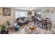Cozy living room with wood-look floors, comfortable seating and decor at 5093 Sun Valley Dr, Las Vegas, NV 89122