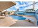 Private pool with diving board, lounge area, and a colorful mural adds character to the outdoor space at 5093 Sun Valley Dr, Las Vegas, NV 89122
