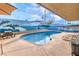 Outdoor pool with unique mural, bench seating and lounge chairs, perfect for enjoying sunny days at 5093 Sun Valley Dr, Las Vegas, NV 89122