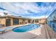 Outdoor pool featuring lounge chairs, diving board and concrete patio area, perfect for outdoor enjoyment at 5093 Sun Valley Dr, Las Vegas, NV 89122