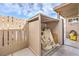 Exterior storage area with a wooden fence and cover, providing practical outdoor space at 5093 Sun Valley Dr, Las Vegas, NV 89122