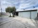 Backyard featuring a concrete patio, a tree, and a view of the house at 524 Bedford Rd, Las Vegas, NV 89107
