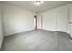 Bedroom showcasing gray flooring, painted block walls, and two doors leading to other rooms at 524 Bedford Rd, Las Vegas, NV 89107