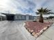 Charming exterior view of a home, featuring a well-maintained yard and a covered carport at 524 Bedford Rd, Las Vegas, NV 89107